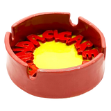 Behind A Cigarette Ashtray
